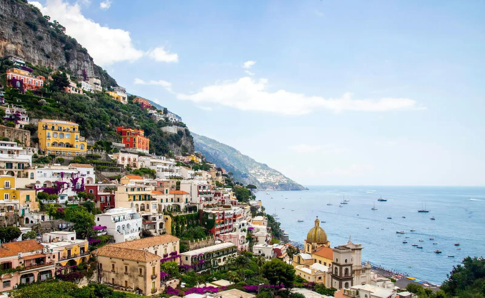 Pastel houses of Positano climbing the cliffs above the sea