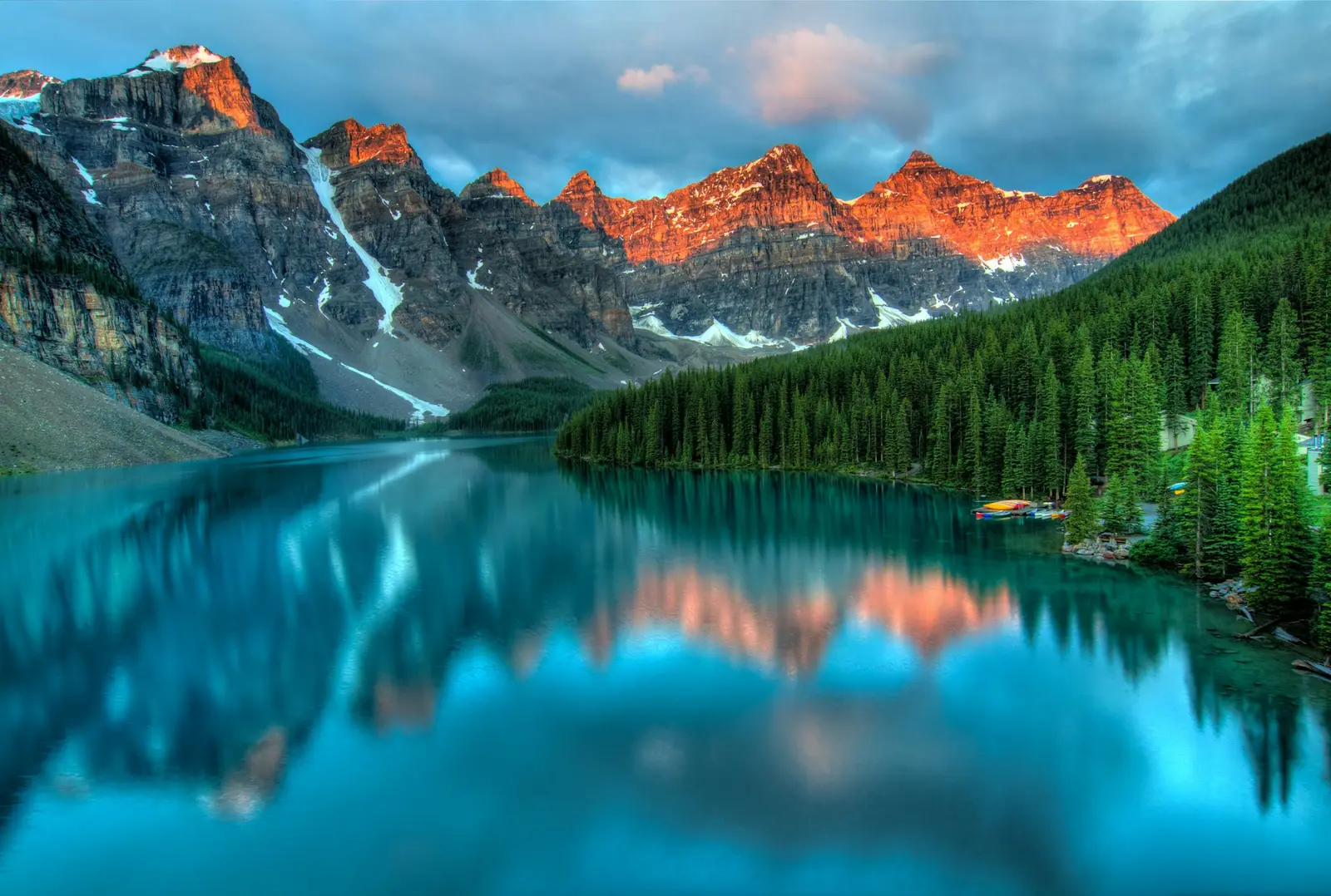 Moraine Lake reflecting the Valley of the Ten Peaks at sunrise