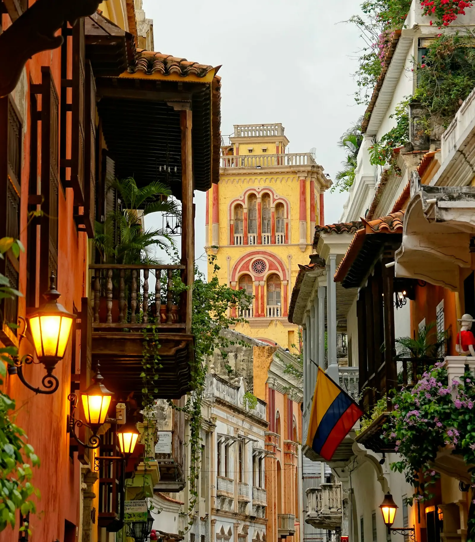 A street of colonial balconies leading to the cathedral tower in Cartagena