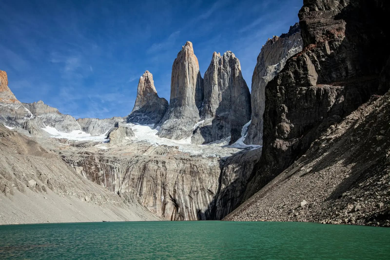 The three granite towers above a green glacial lake in Torres del Paine